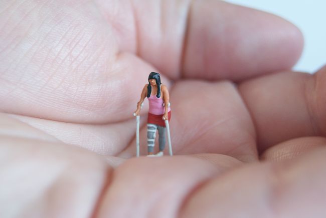 small model figure with crutches