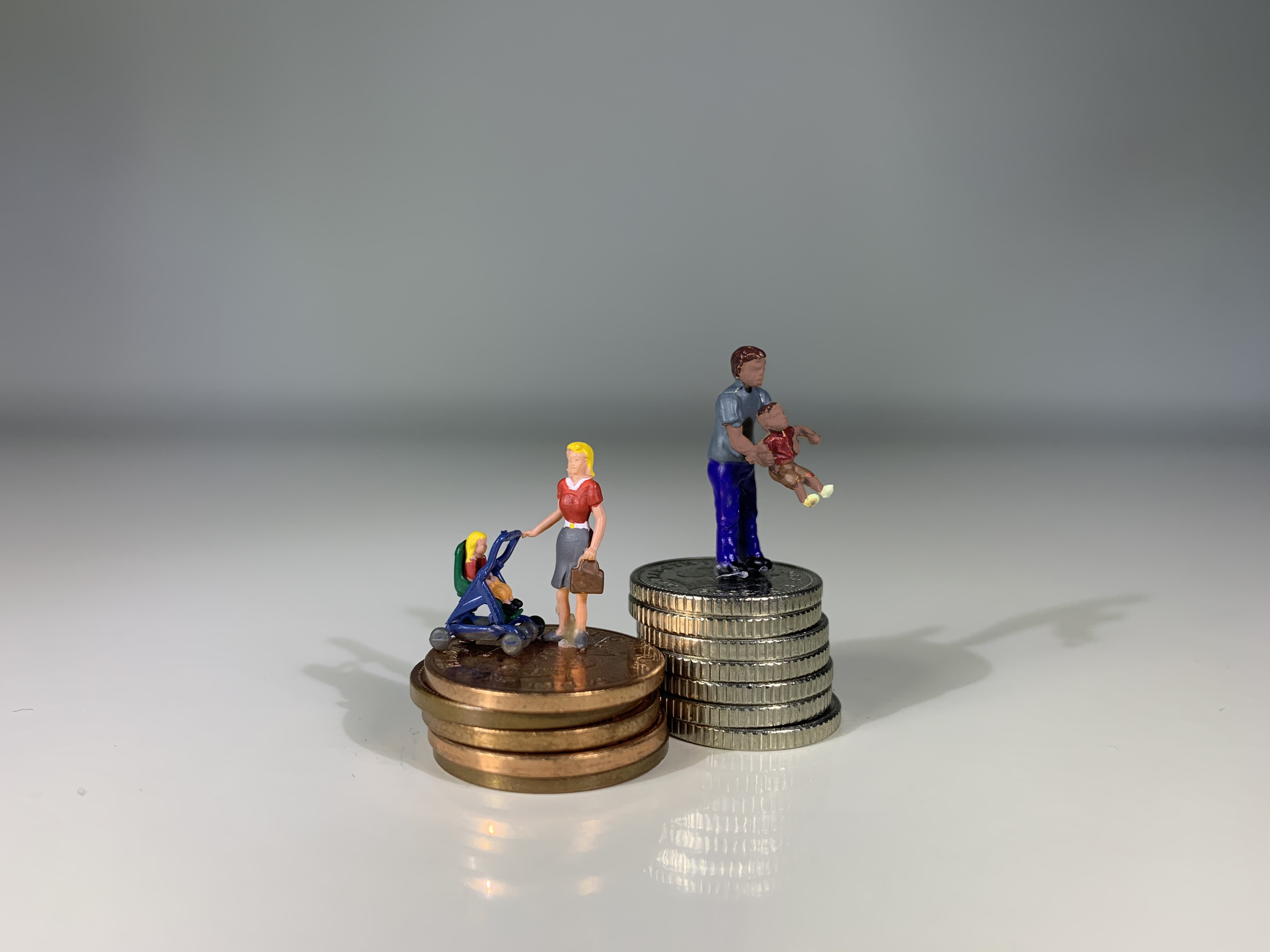 Family playing on top of coins